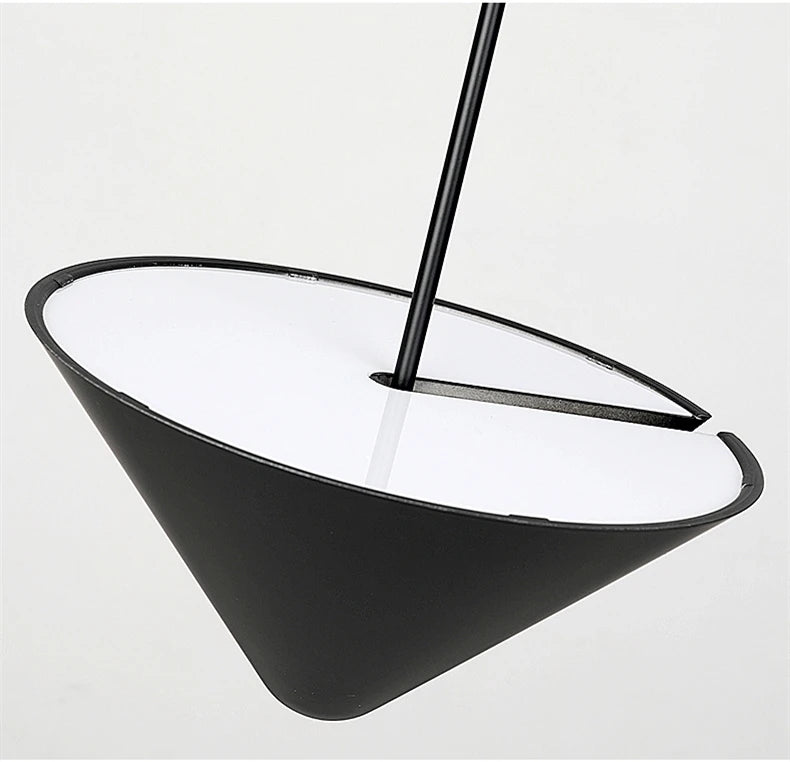 Detail view of the A.T.I.A. Pendant Light revealing the sleek conical shade with integrated diffuser and central stem,by Domus Collective modern design combining sophisticated form with soft illumination.
