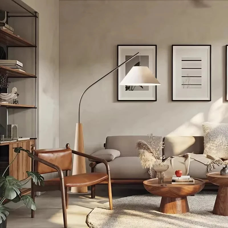 Driftwood Reel Floor Lamp with blonde wood tapered base bringing soulful natural texture to warm-toned living space with leather and timber furnishings,from Domus Collective Organic Accents collection.
