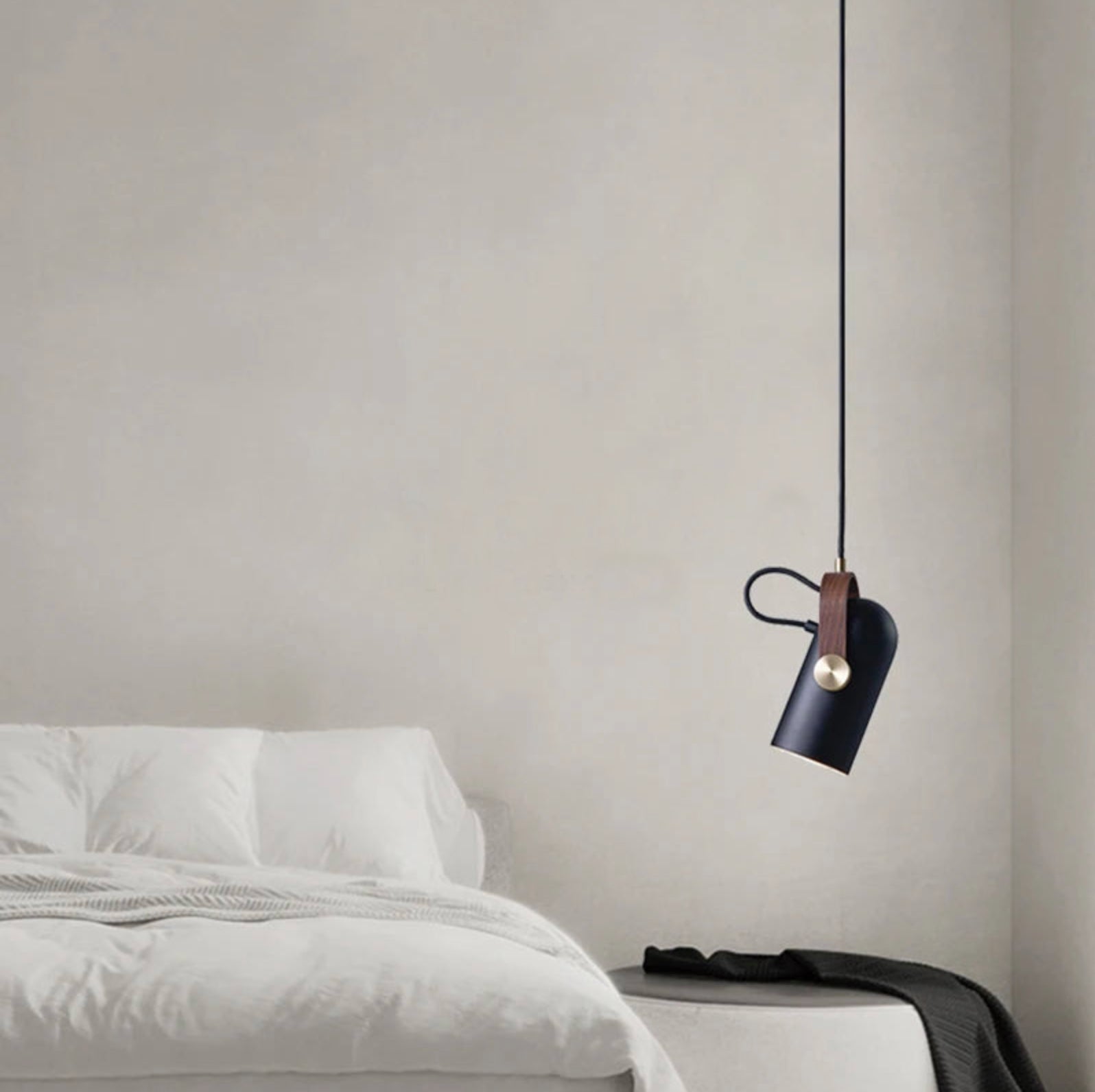 Artisan-crafted Film Projector Pendant Light with cylindrical black shade and wood accent, refined directional pendant bringing vintage character to serene minimalist bedrooms, by Domus Collective.