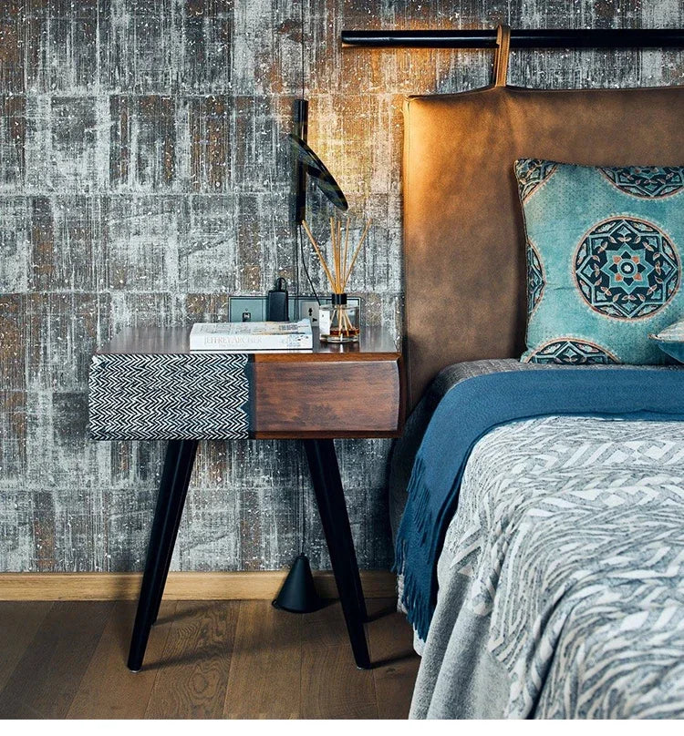 Matte black Floating Disc  Suspension Lights positioned as bedside lighting in a sophisticated bedroom with textured wallpaper, contemporary design by Domus Collective.