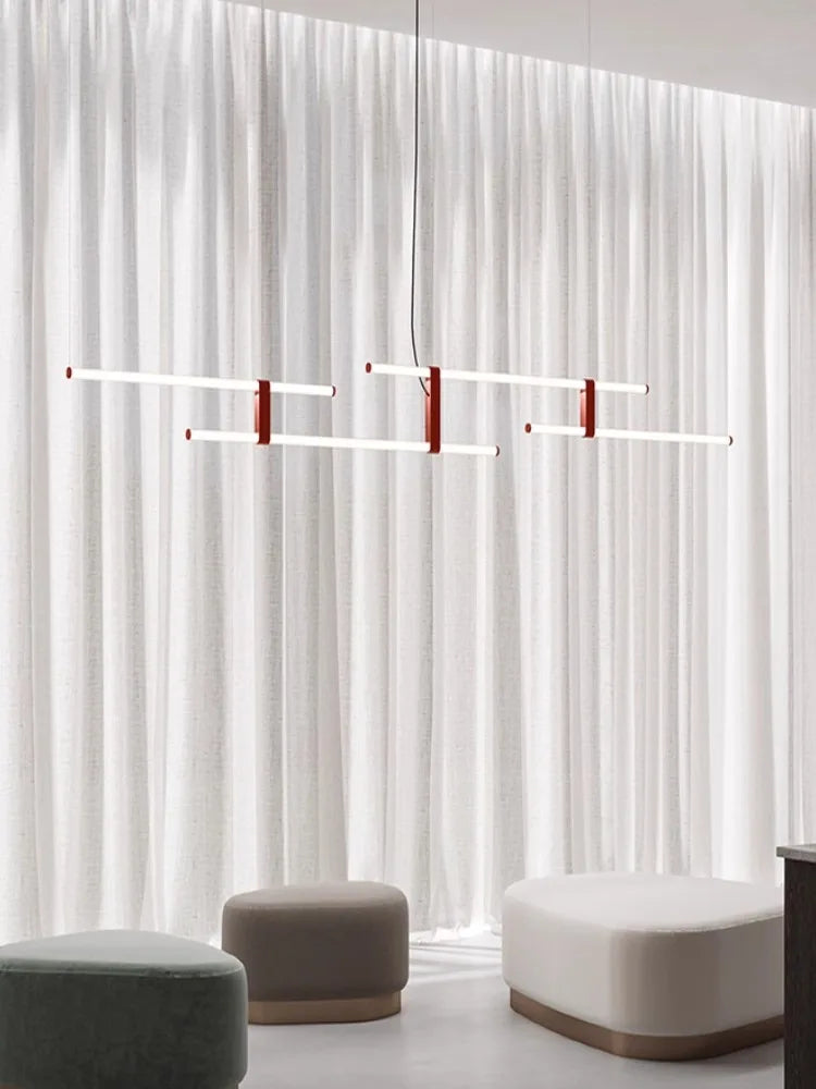 In Parallel Suspension Light in red vegan leather, lines of light composed against sheer linen like an abstract artwork, a sculptural statement piece for contemporary spaces, by Domus Collective.