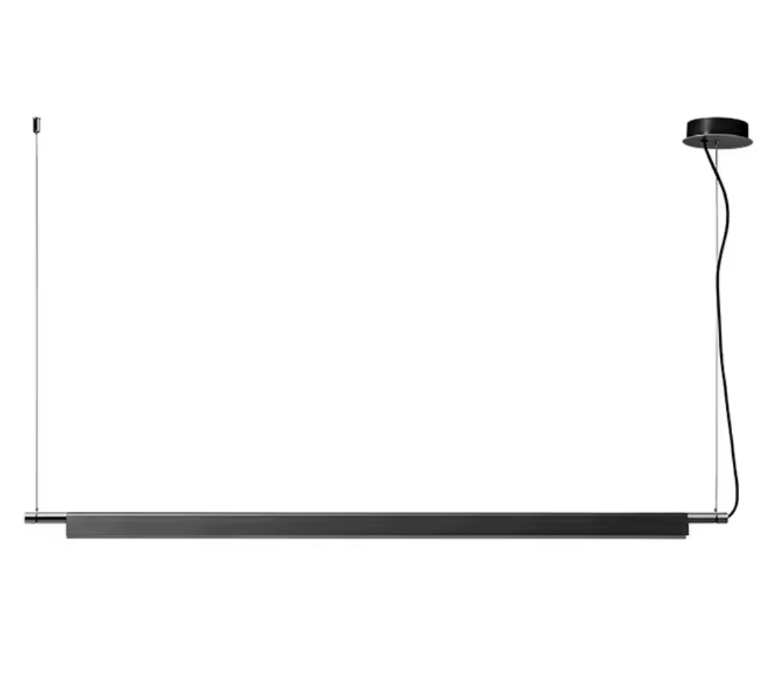 A Lama dell'Architetto Pendant Light by Domus Collective, in black. The linear blade with matching black canopy, clean architectural lighting for kitchen islands, dining tables and modern workspaces.