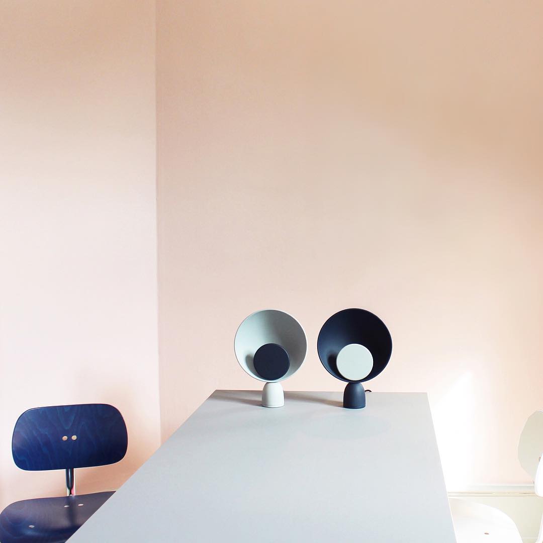Complementary pair of Lunar Eclipse Table Lamps in grey with navy accent and navy with grey accent, their contrasting yet harmonious designs perfect for modern Scandinavian interiors.