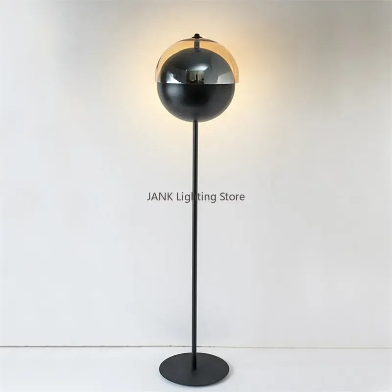 Full-height Lunar Visor Floor Lamp displaying its complete silhouette with smoked glass globe shade and circular matte black base, minimalist standing light by Domus Collective.