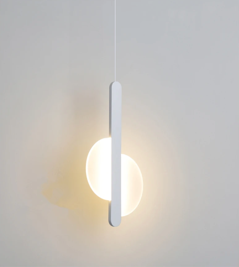 Matchstick Slice Pendant Light in white finish, its vertical form slicing through a glowing frosted orb for a striking interplay of geometry and warm illumination, by Domus Collective.