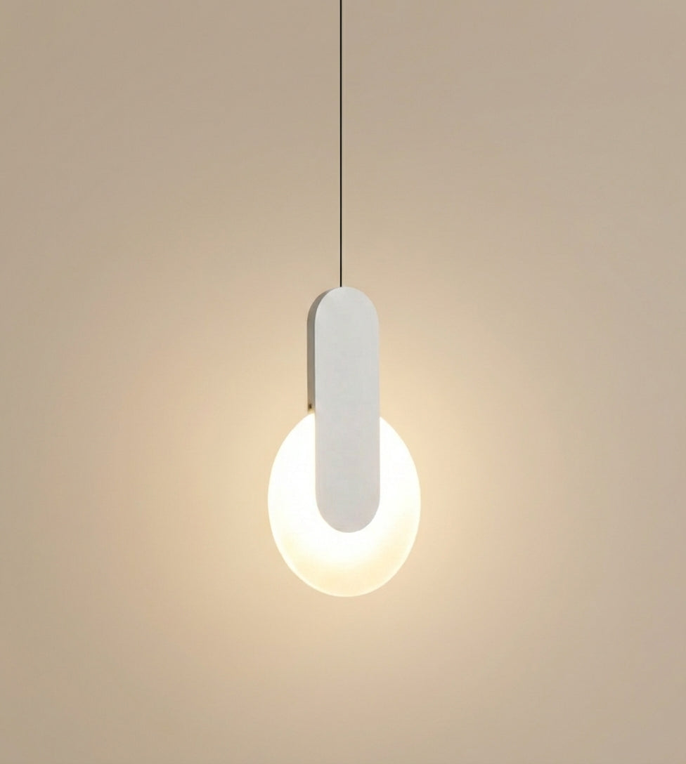  Matchstick Slice Pendant Light in soft white finish, its curved metal bracket embracing a glowing orb for understated elegance and tranquil ambient atmosphere, by Domus Collective.