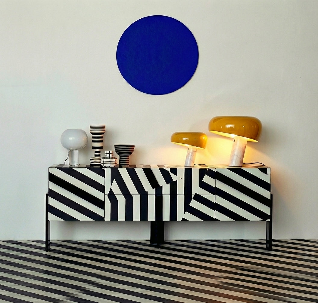 Pair of golden yellow Mushroom Beam Table Lamps with glossy glass shades on marble bases creating warm layered lighting in a graphic monochrome interior, curated designer collection by Domus Collective.