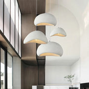 Domus Collective Organic Stones Pendant Light in white, a cascading cluster filling a double-height atrium with organic sculptural presence, nature-inspired form at an architectural scale.