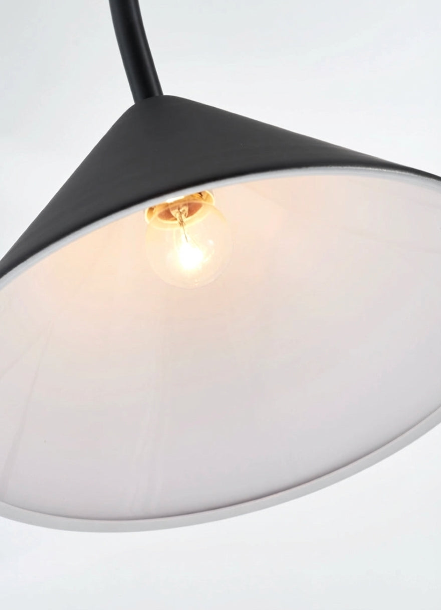 Detail view of the Out Fishing Wall Lighting revealing warm soft illumination from within the conical shade, Domus Collective timeless design where playful inspiration meets refined modern aesthetics.

