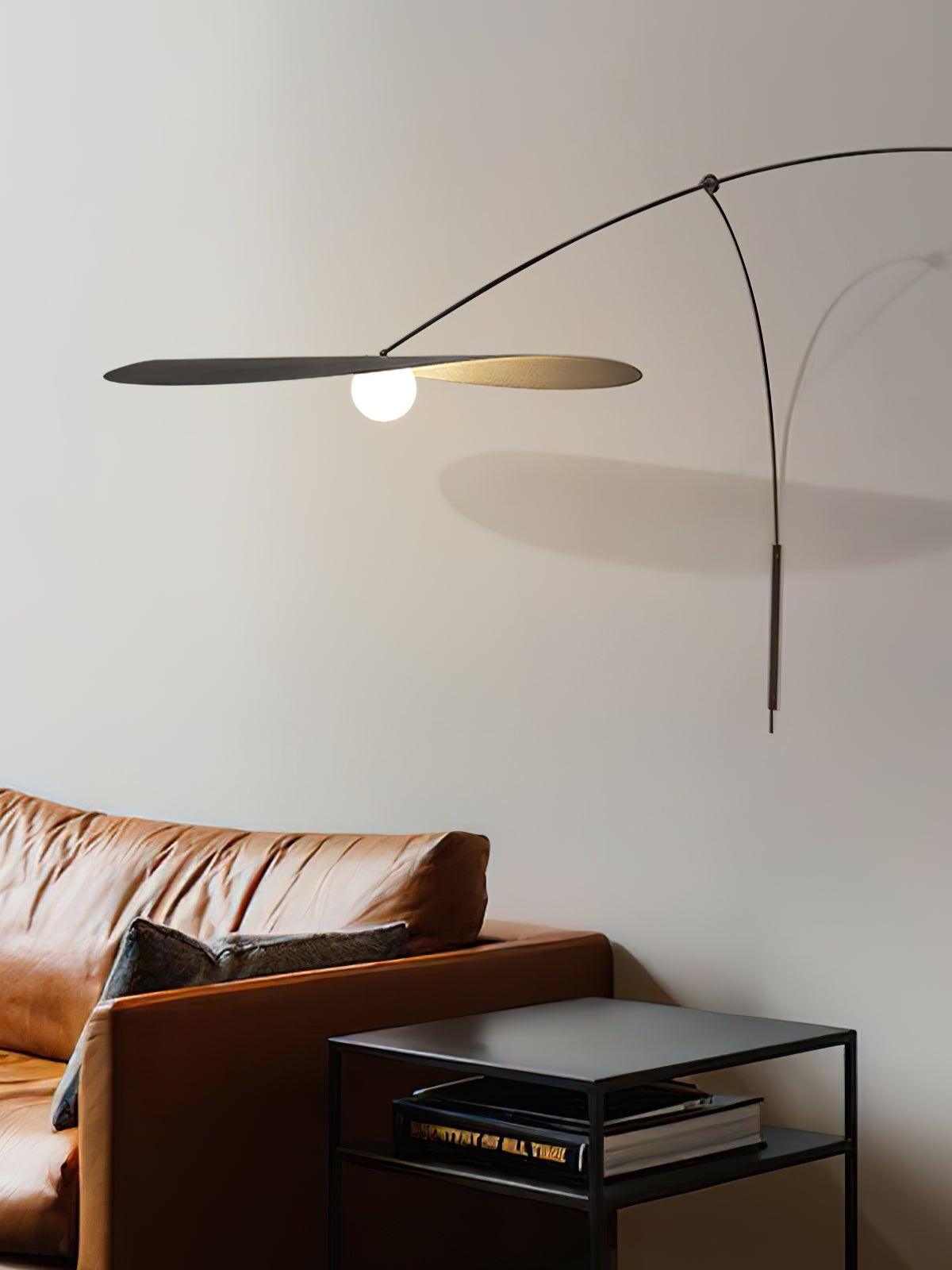 Organic wall lighting with elongated curved arm and layered elliptical shades, the Papilla Wall Lamp brings sculptural elegance and warm glow to modern living room settings.