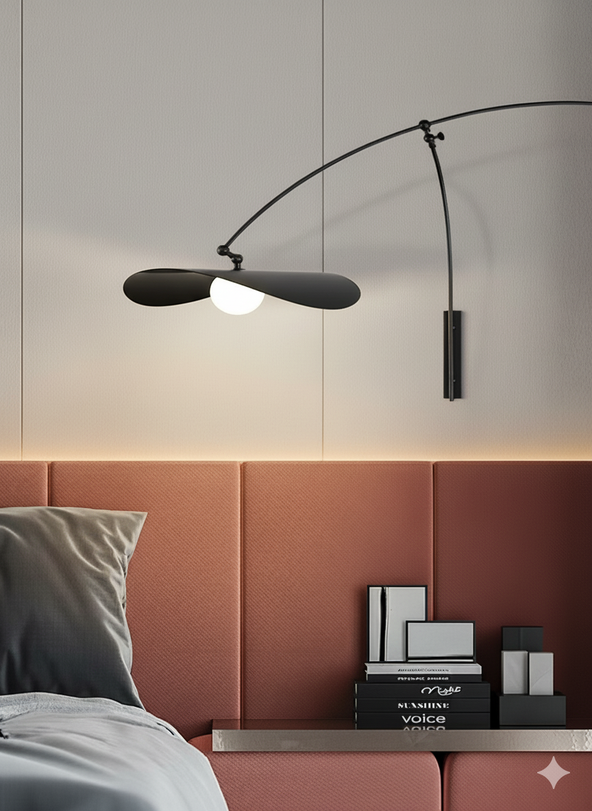 Papilla Wall Lamp in matte black finish with curved swing arm and butterfly shade design featuring frosted globe bulb, adding sculptural sophistication to contemporary bedroom interiors.
