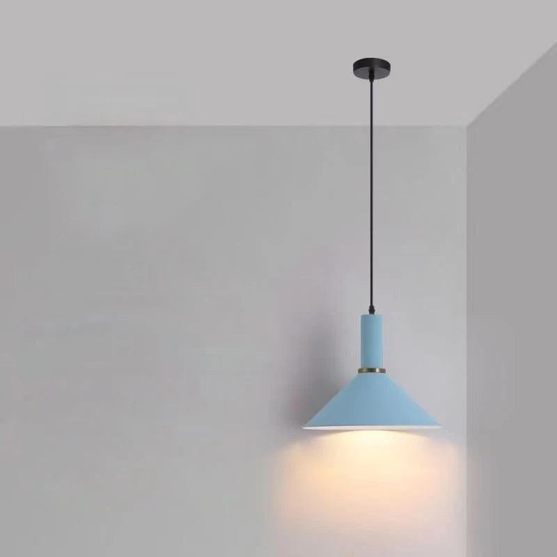 Airy baby blue cone with gold ring creates cheerful focal points for coastal-inspired rooms in this Pastel Rainbow Pendant Light, by Domus Collective.