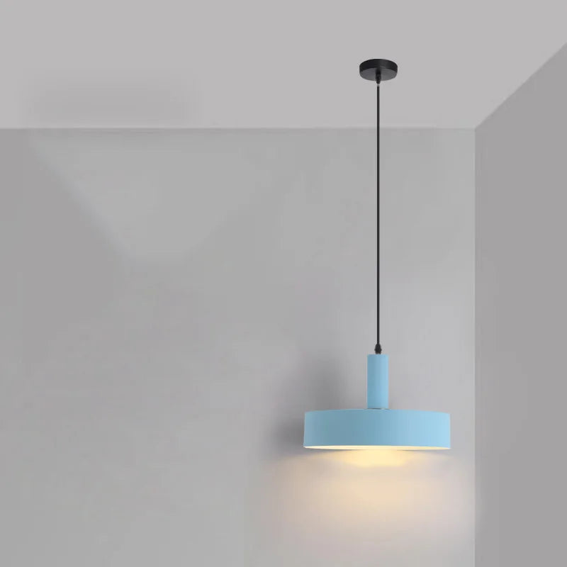 Powder blue shallow drum with brass detail adds playful Scandinavian charm above kitchen islands in this Pastel Rainbow Pendant Light, by Domus Collective.