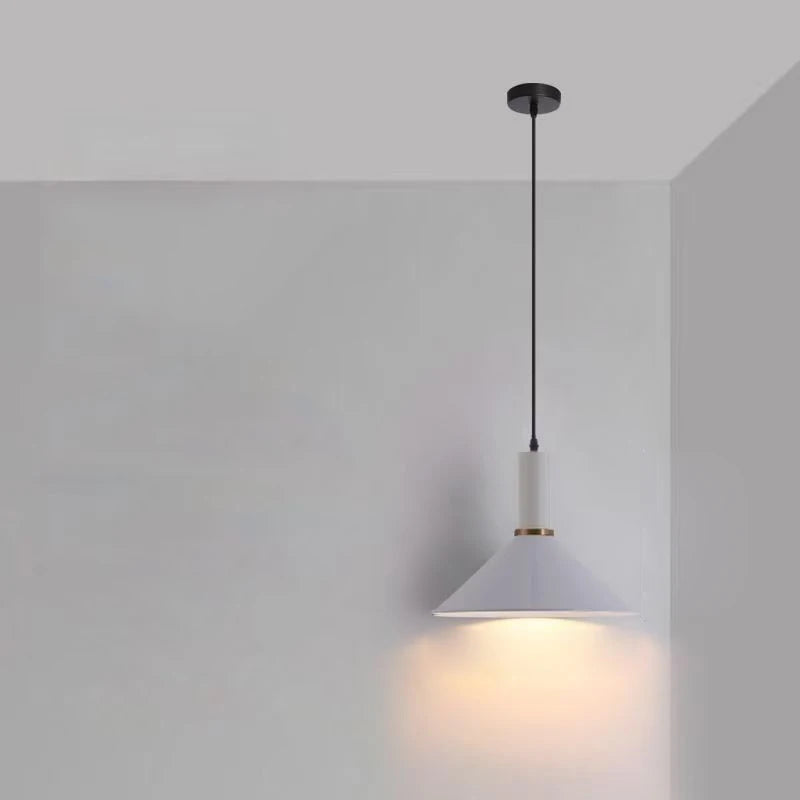 Soft white conical silhouette with a gold accent ring gives this Pastel Rainbow Pendant Light refined minimalist appeal for modern Scandinavian dining spaces, by Domus Collective.