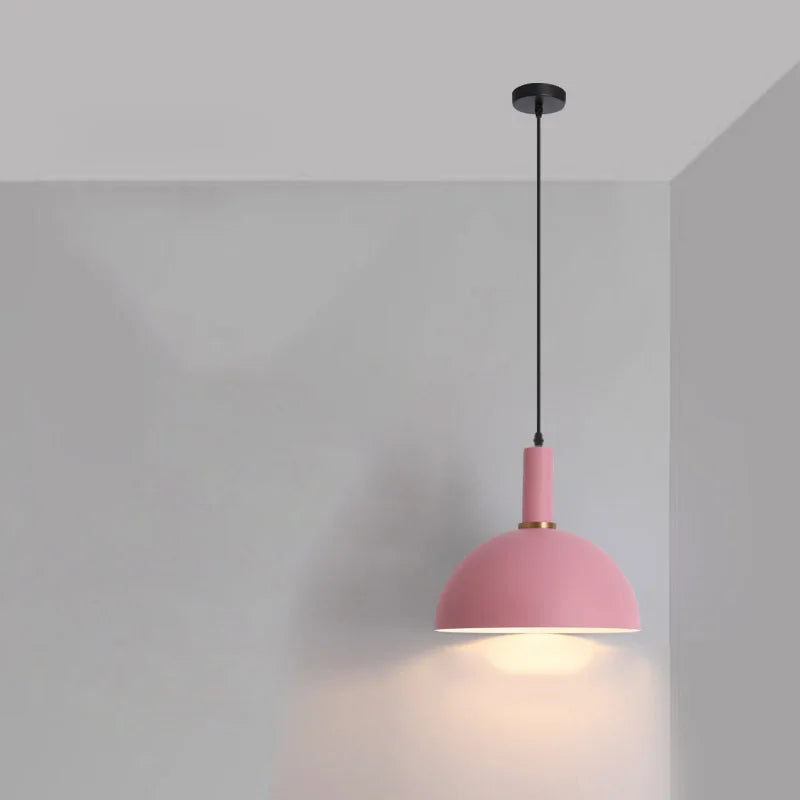 Feminine blush pink dome with brass ring accent brings soft romantic warmth to nurseries and bedrooms in this Pastel Rainbow Pendant Light, by Domus Collective.