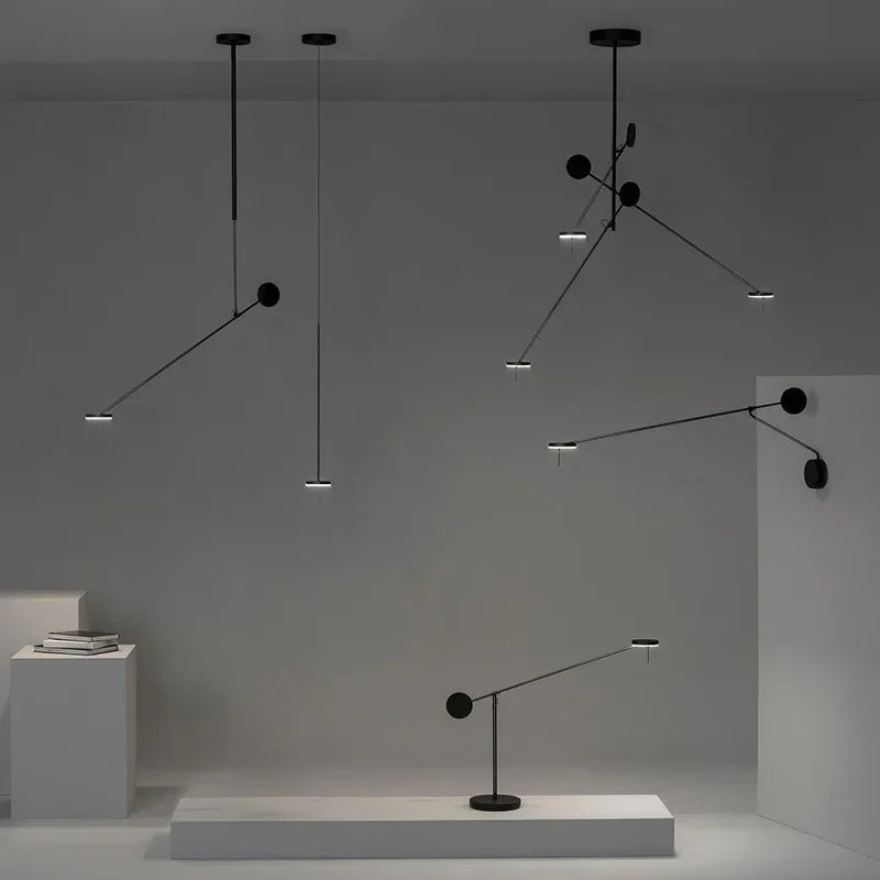 The complete Refined Span lighting collection displayed together, featuring wall light, pendant, and desk lamp configurations with matching black metal finishes and signature disc elements by Domus Collective.