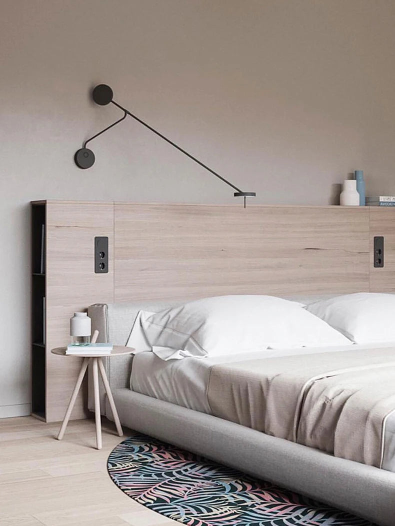 Minimalist bedside lighting featuring the Refined Span Wall Light with articulating arm and dual disc design in black finish, creating a serene reading atmosphere in contemporary bedrooms.