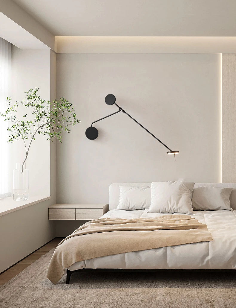 Architecturally inspired wall sconce with adjustable swing arm and matte black metal finish, the Refined Span Wall Light brings functional elegance to minimalist bedroom interiors.
