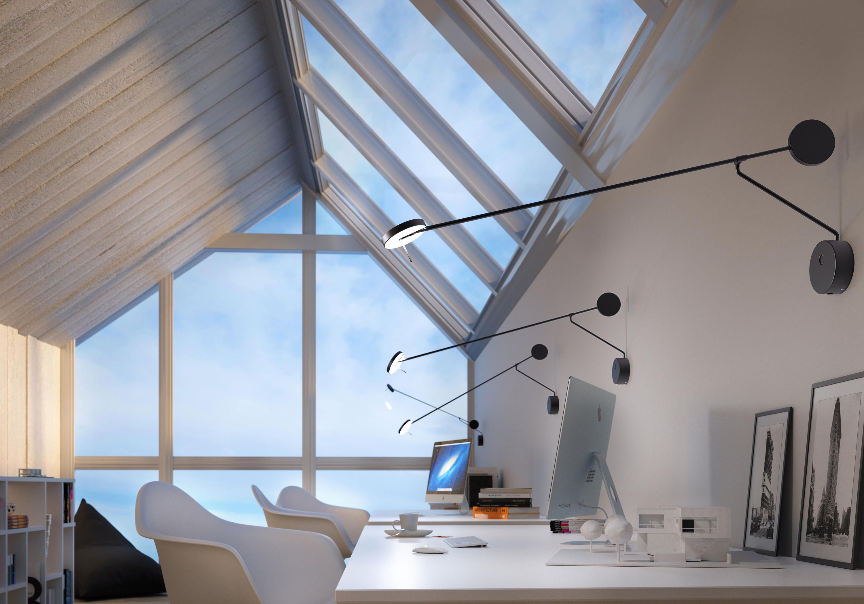 Refined Span Wall Light in matte black metal with extended swing arm and circular counterweight, providing sculptural task lighting for modern home offices with skylights, by Domus Collective.