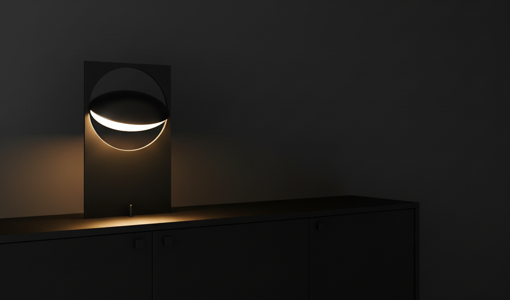 Riflesso Table Lamp in matte black casting lunar glow from tilted reflector disc on dark sideboard, adding atmospheric drama to minimalist spaces by Domus Collective.