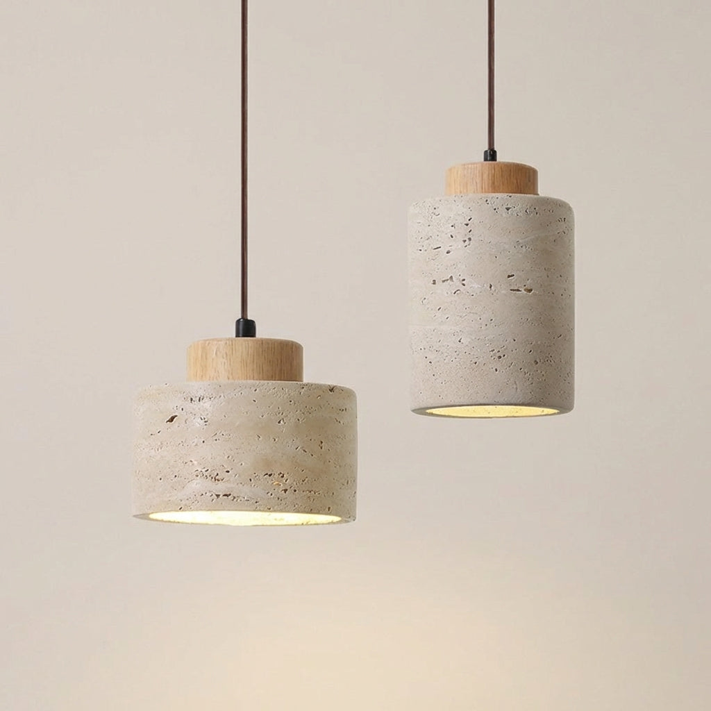Natural stone meets warm wood in the Stone Cylinder Pendant Lamp, available in two cylindrical heights ,short,tall,with characteristic travertine veining and soft ambient downlighting, by Domus Collective.