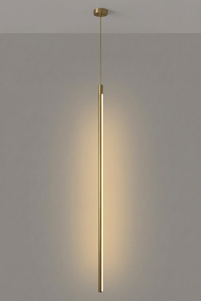 Warm metallic brass finish with sleek elongated silhouette creating timeless sophisticated ambient lighting,the Streamline Shine Suspension Light as a characterful statement piece for contemporary Australian interiors,by Domus Collective curated collection.