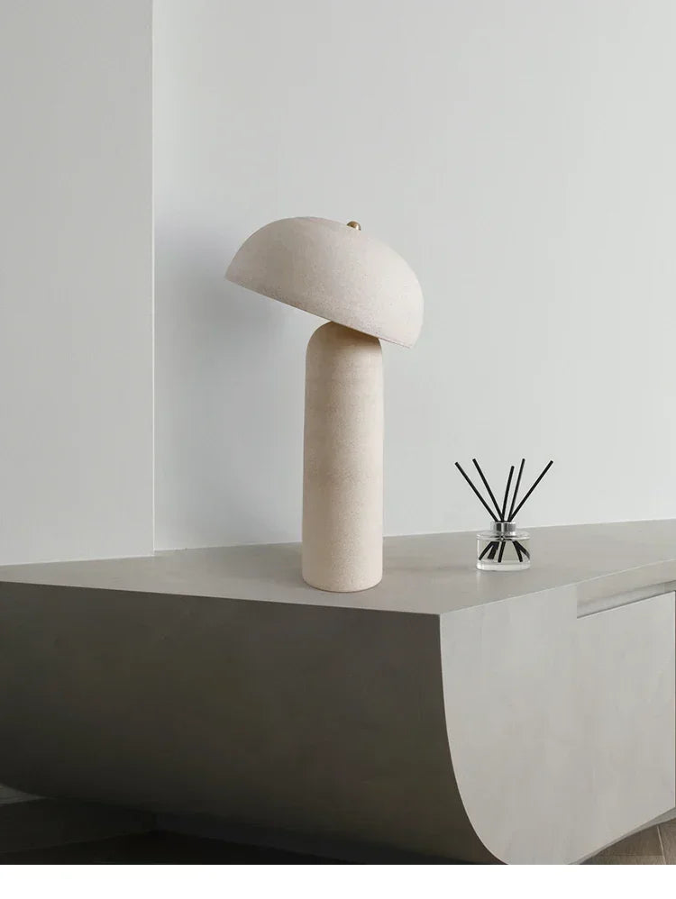 Terra Mushroom Table Lamp with adjustable angled shade in matte cream ceramic, organic nature-inspired form adding grounded warmth to minimalist contemporary interiors, by Domus Collective.