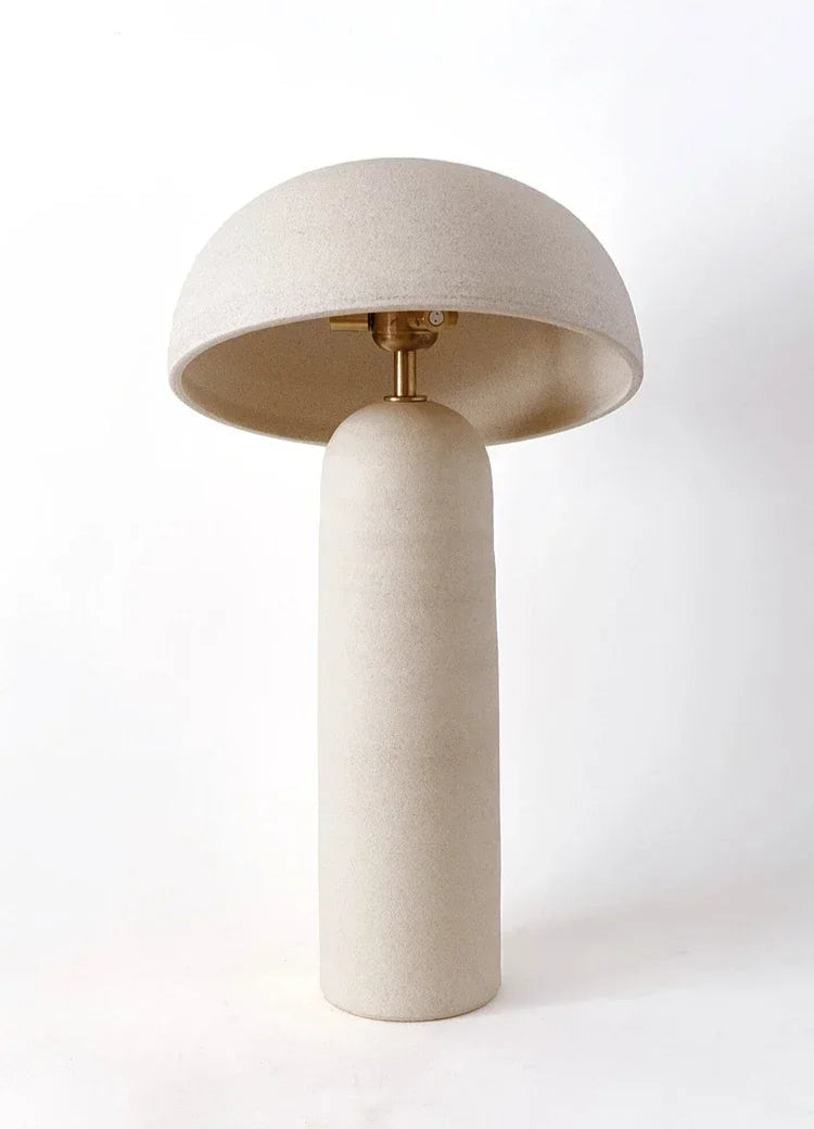Terra Mushroom Table Lamp in off-white ceramic with brushed brass socket hardware, organic sculptural form combining earthy elegance with warm ambient lighting, by Domus Collective.