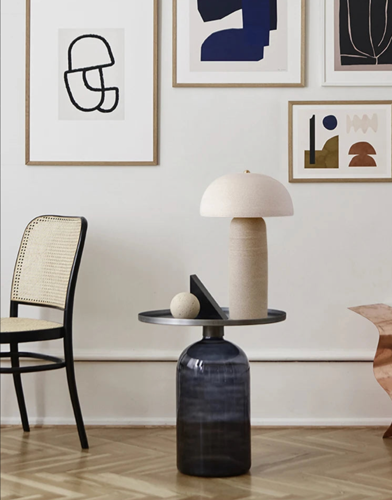 Terra Mushroom Table Lamp in natural cream ceramic with organic dome shade and cylindrical base, sculptural earthy elegance displayed in a curated gallery-style living room, by Domus Collective.