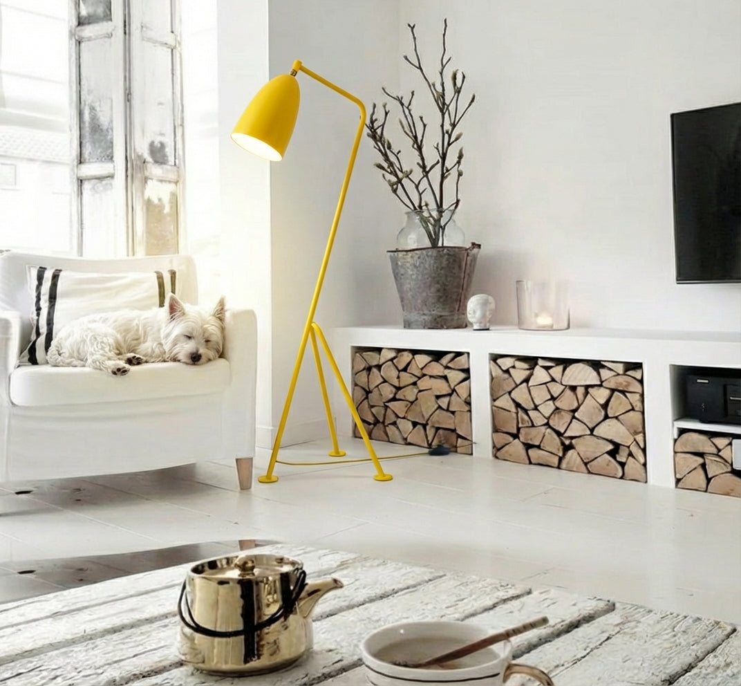 The Long Neck Floor Lamp in yellow with architectural metallic finish defining the space as a statement piece in a curated Scandinavian interior,by Domus Collective floor lamp, distinctive sculptural lighting.