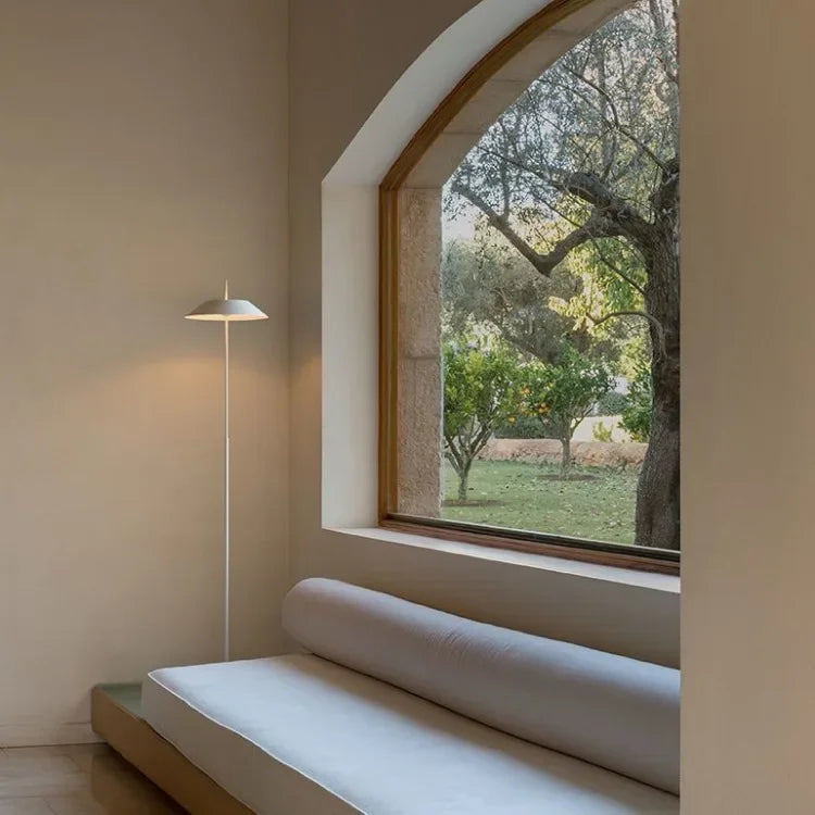 Warm Mediterranean-inspired interiors elevated by the Toothpick Balance Floor Lamp in matte white, a refined statement piece offering tranquil ambient illumination, by Domus Collective.