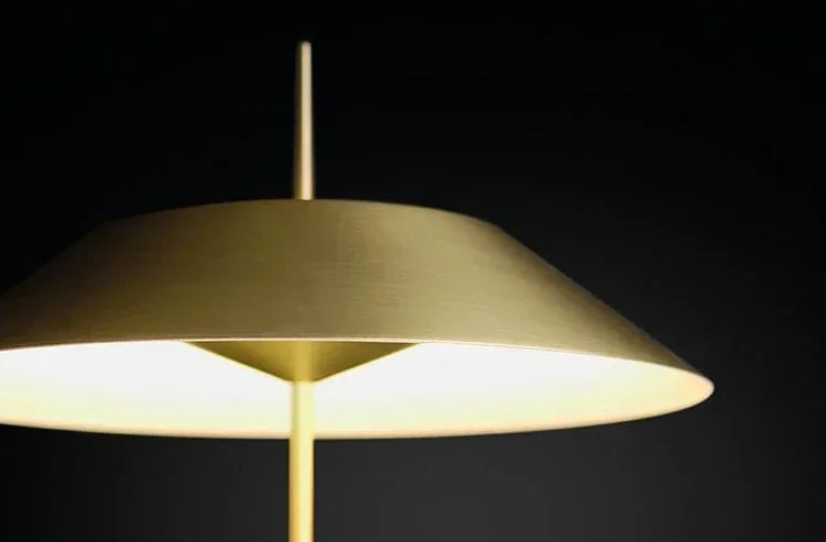 Brushed brass Toothpick Balance Floor Lamp shade detail highlighting fine metallic texture and warm ambient light emission, artisan-quality craftsmanship, by Domus Collective.