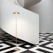 Toothpick Balance Floor Lamp in brushed brass finish, minimalist sculptural lighting with a slender stem and conical shade delivering soft ambient glow, by Domus Collective.