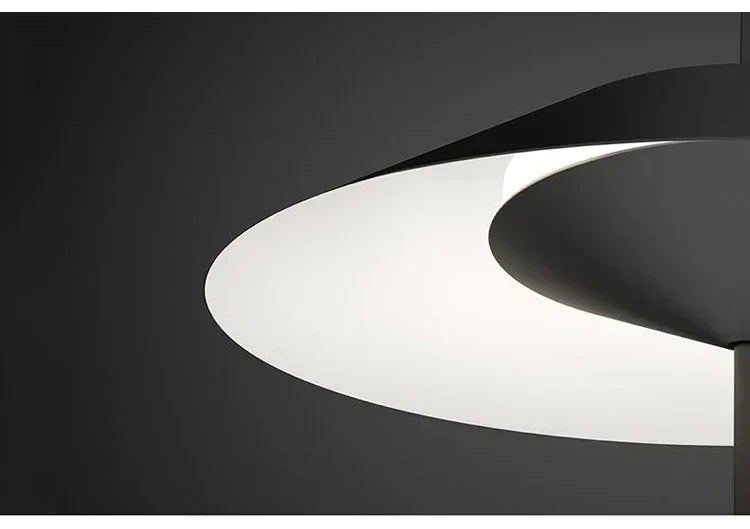 Detail of the Toothpick Balance Table Lamp shade in matte black showing its smooth white interior diffuser creating even light distribution, artisan crafted by Domus Collective.