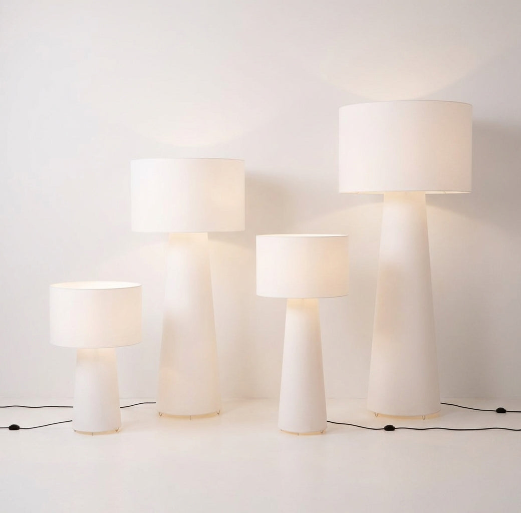 Set of four Tower Glow Floor & Table Lamps from Domus Collective on a light gray contemporary background.