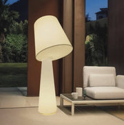 Tip Top Floor Lampglowing with a warm, soft ambient light on a stylish outdoor terrace at dusk — a sculptural, oversized statement piece that transforms Australian outdoor living spaces with timeless elegance by Domus Collective.